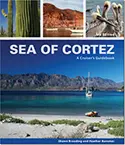 Book cover for 'Sea of Cortez: A Cruiser's Guidebook' showing a sailboat in turquoise water, mountains, cactus, red rocks, and pelicans.