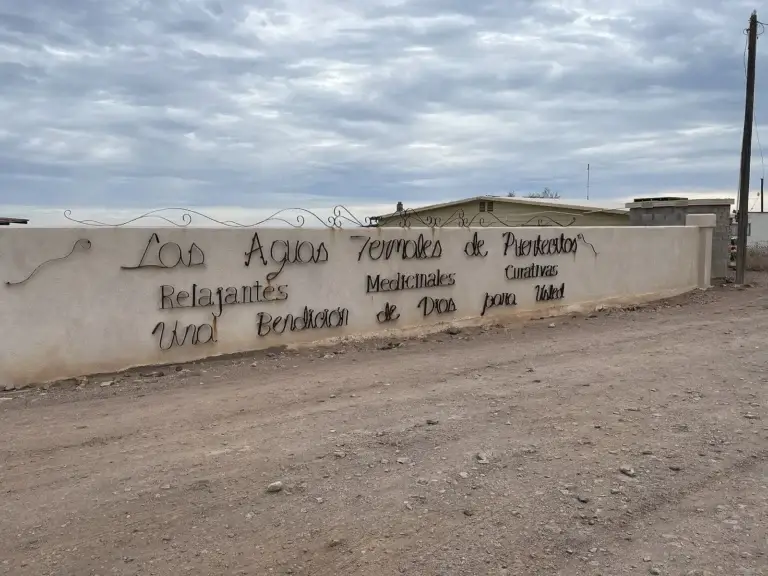 The wrought-iron hot springs sign at the Puertecitos entrance